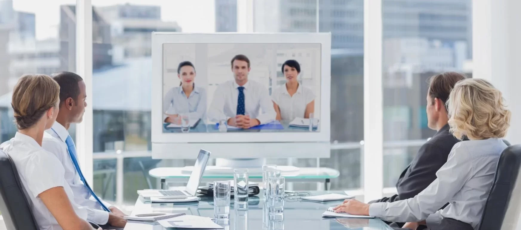 Business people conducting a video conference in a meeting room