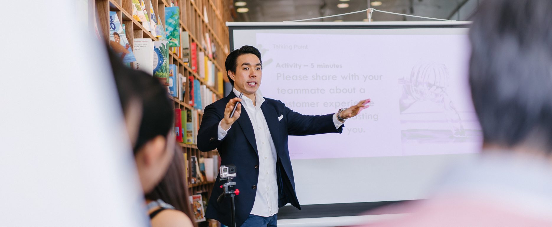 A man presenting to a group of attentive individuals