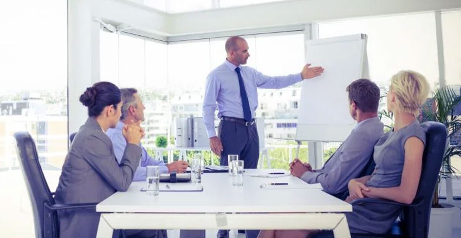 businessman giving presentation to his colleagues