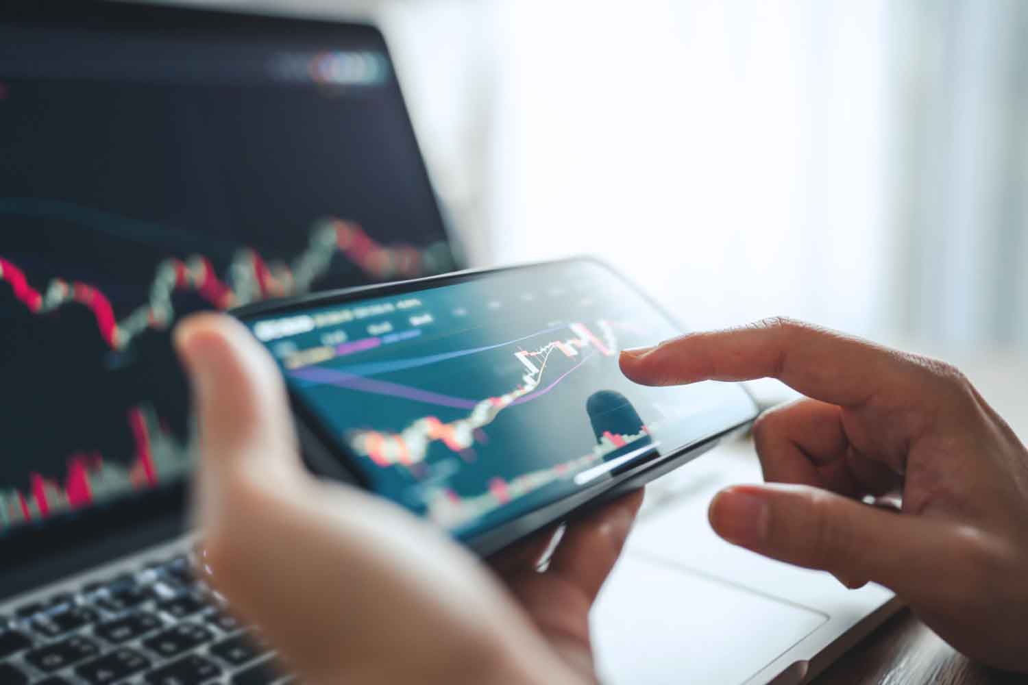 Woman checking price chart on digital exchange on smartphone