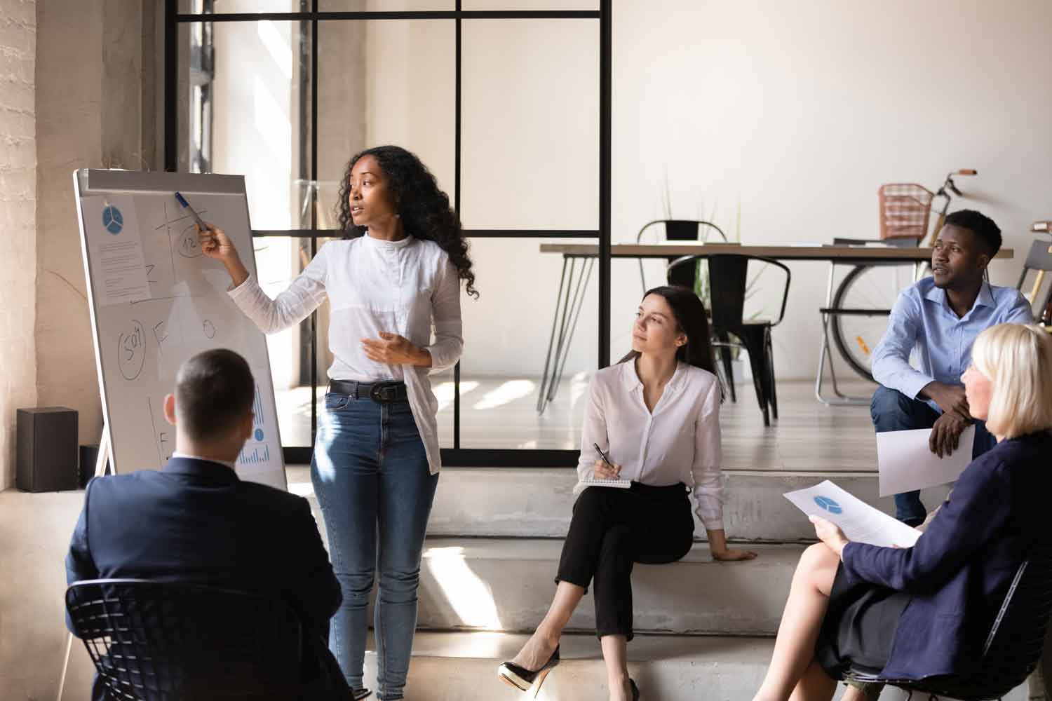 young businesswoman manager give whiteboard presentation at office meeting