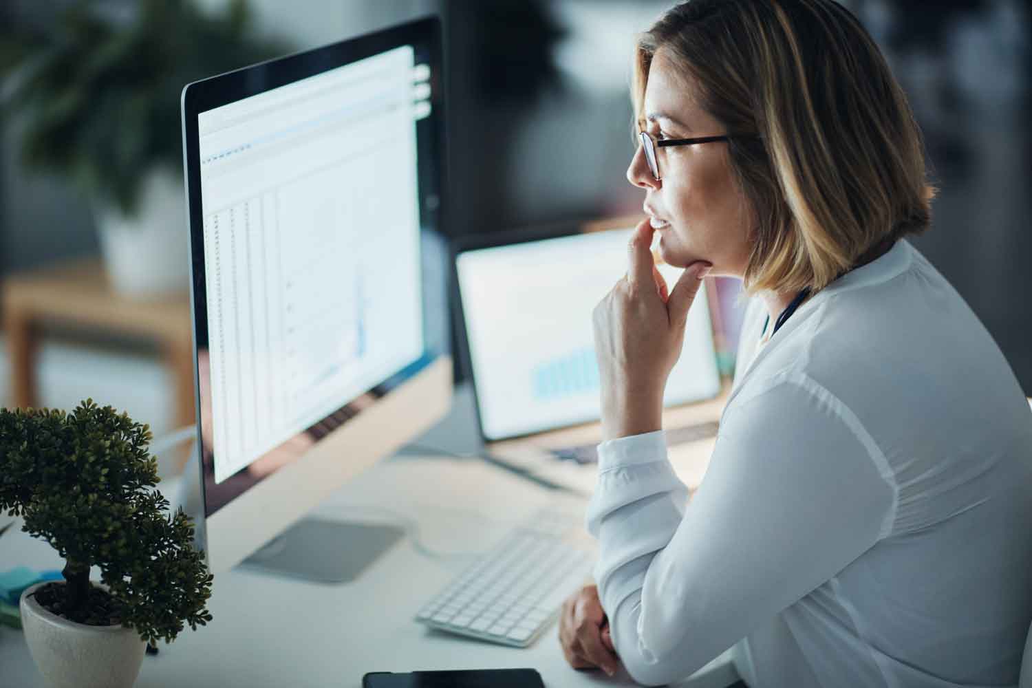 businesswoman using a computer during a late night at work