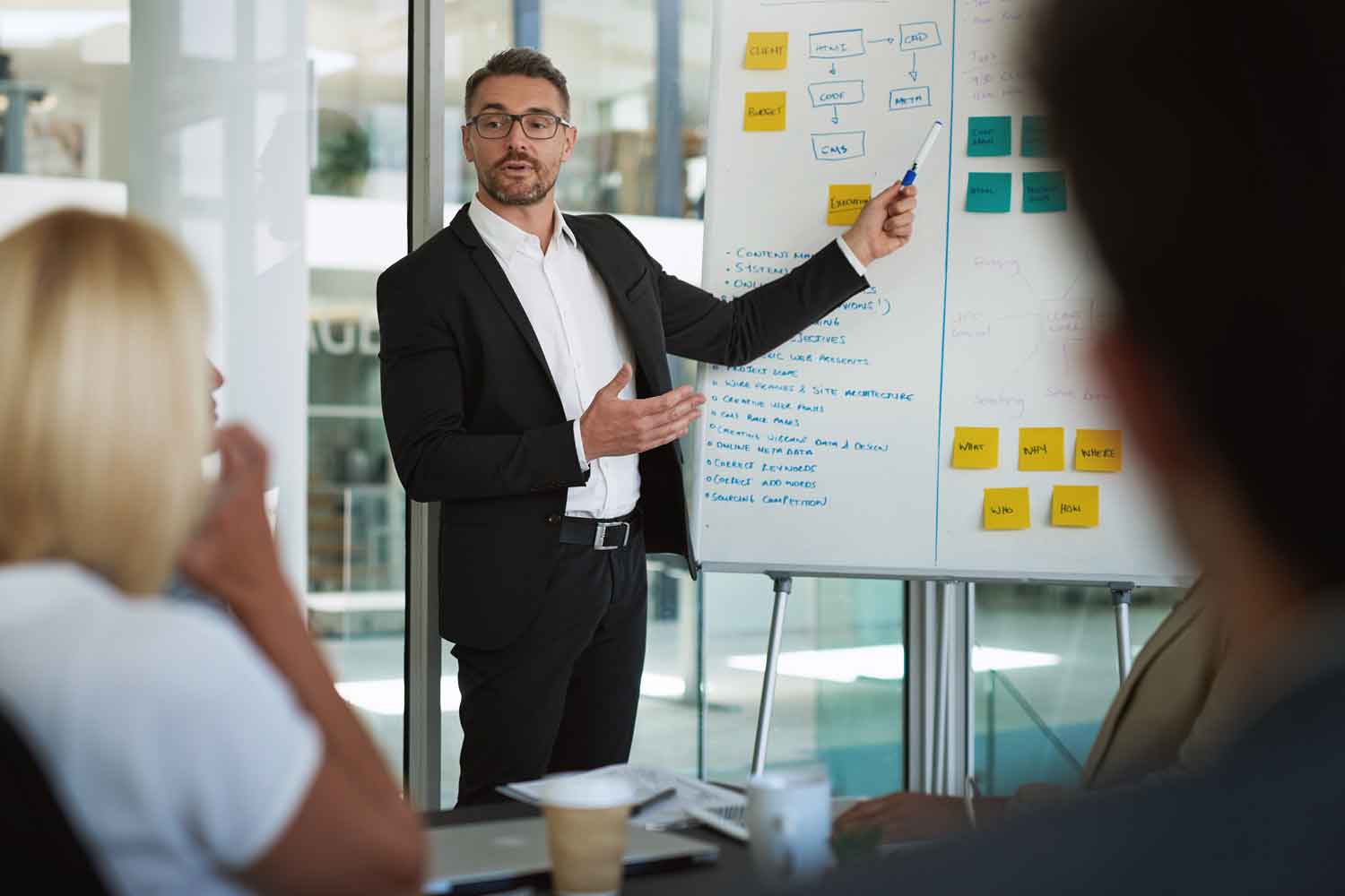 businessman during a presentation to work colleagues in a boardroom