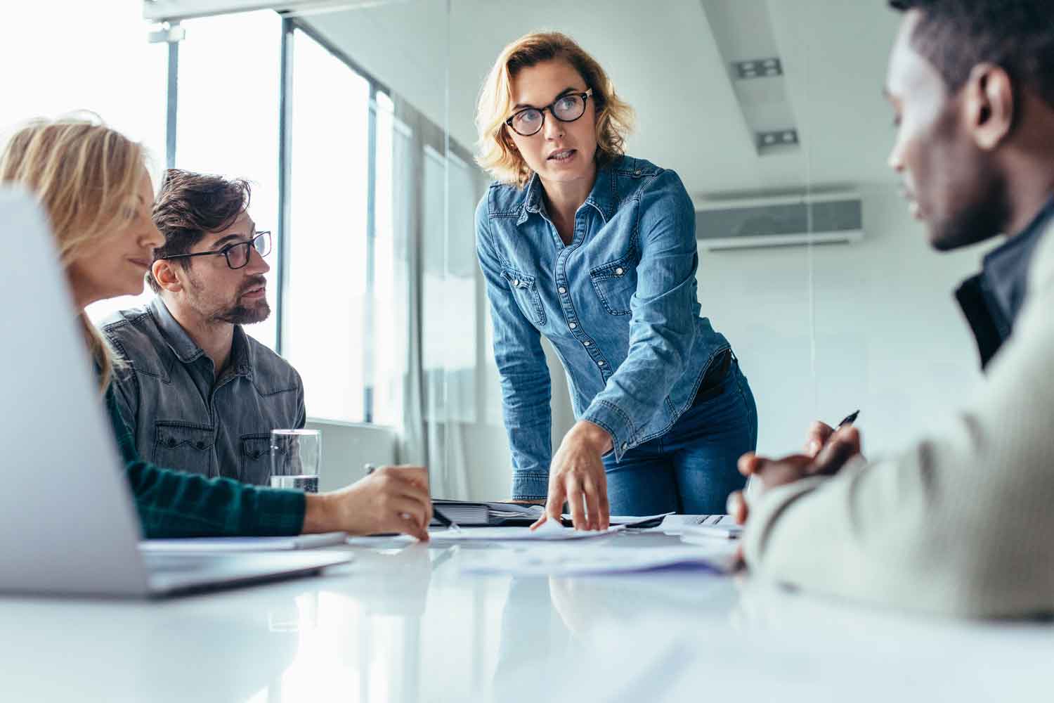 Businesswoman standing and leading business presentation