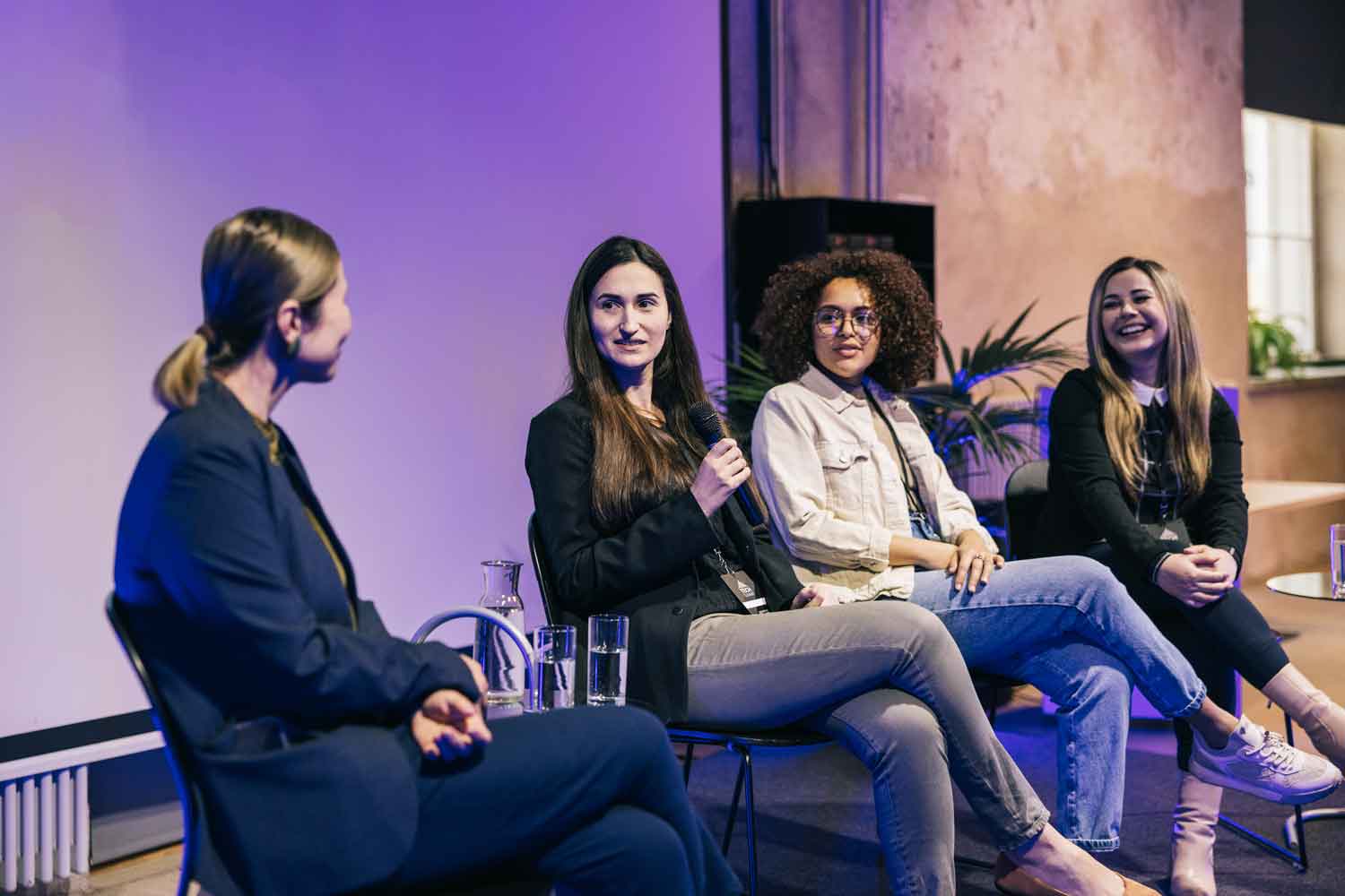 diverse group of female entrepreneurs at panel discussion