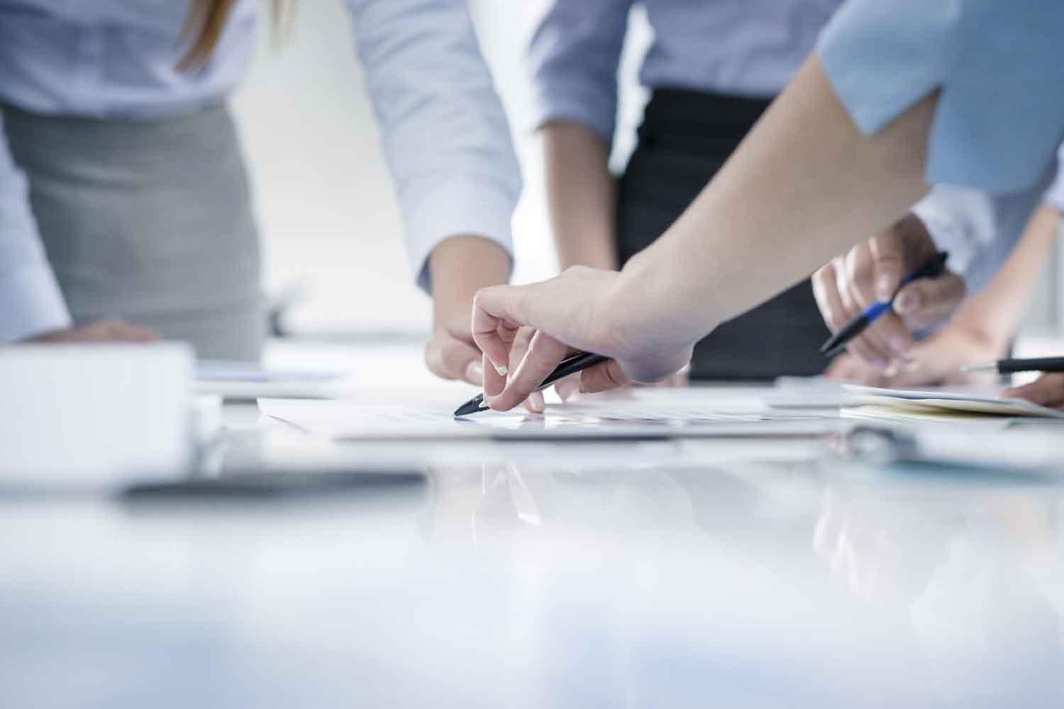 Closeup hands of group of people in a meeting