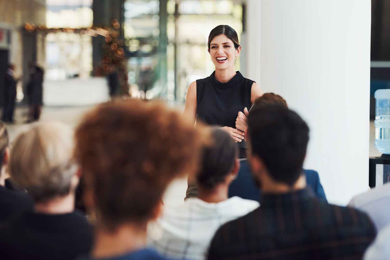 businesswoman delivering a speech during a conference