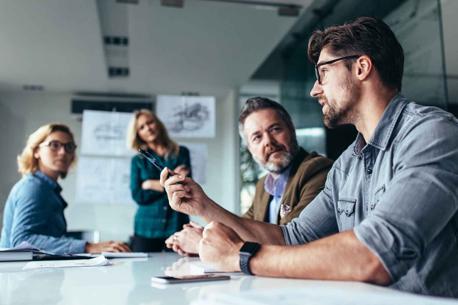 Business people discussing over new business project in office